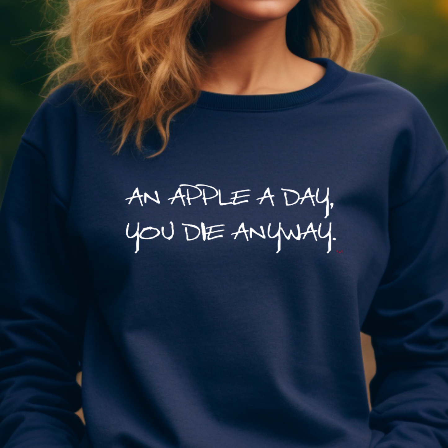 Female model wearing Navy sweatshirt with "An apple a day" Original Nine-29 design