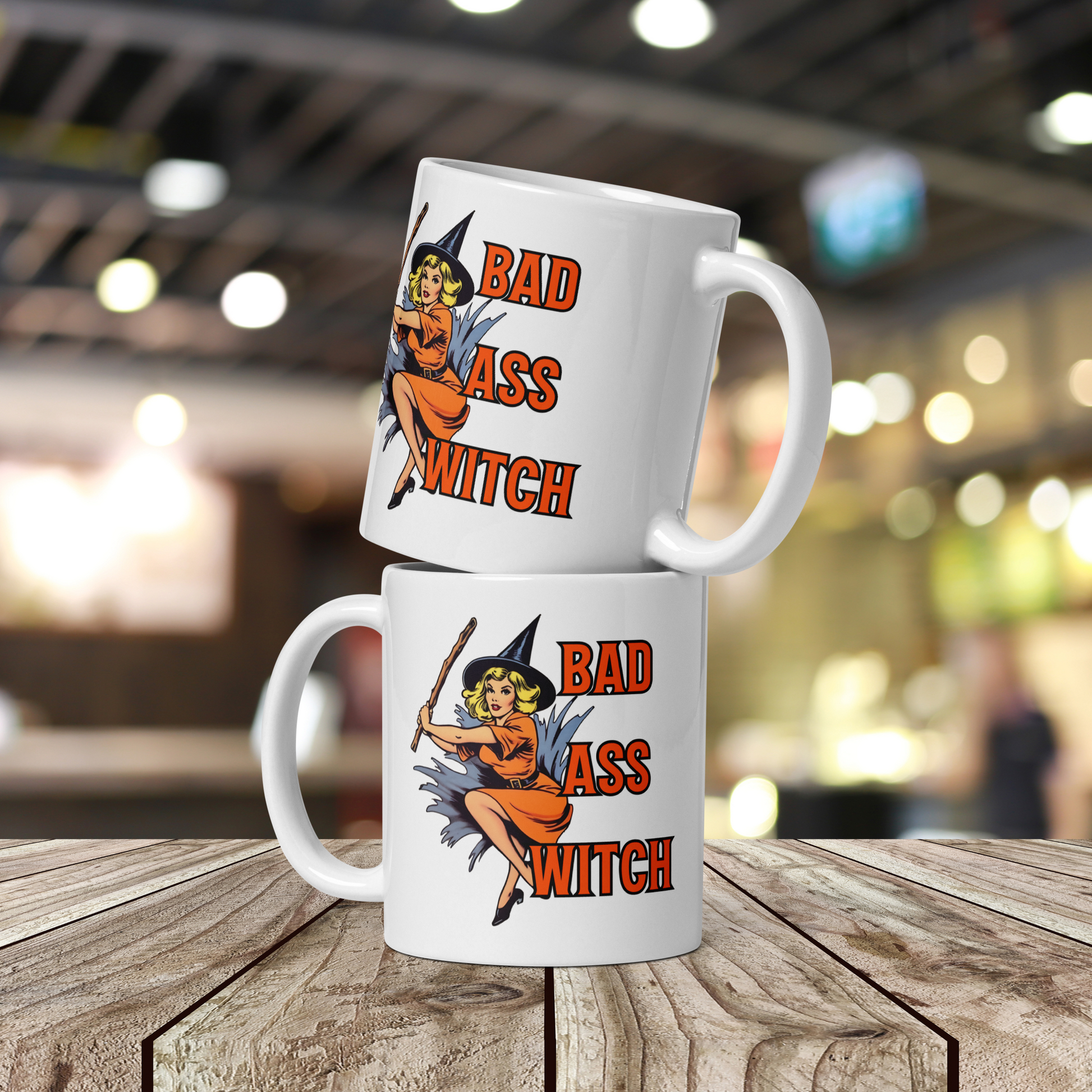 Two stacked-up white mugs with "Bad witch" Original Nine-29 Design