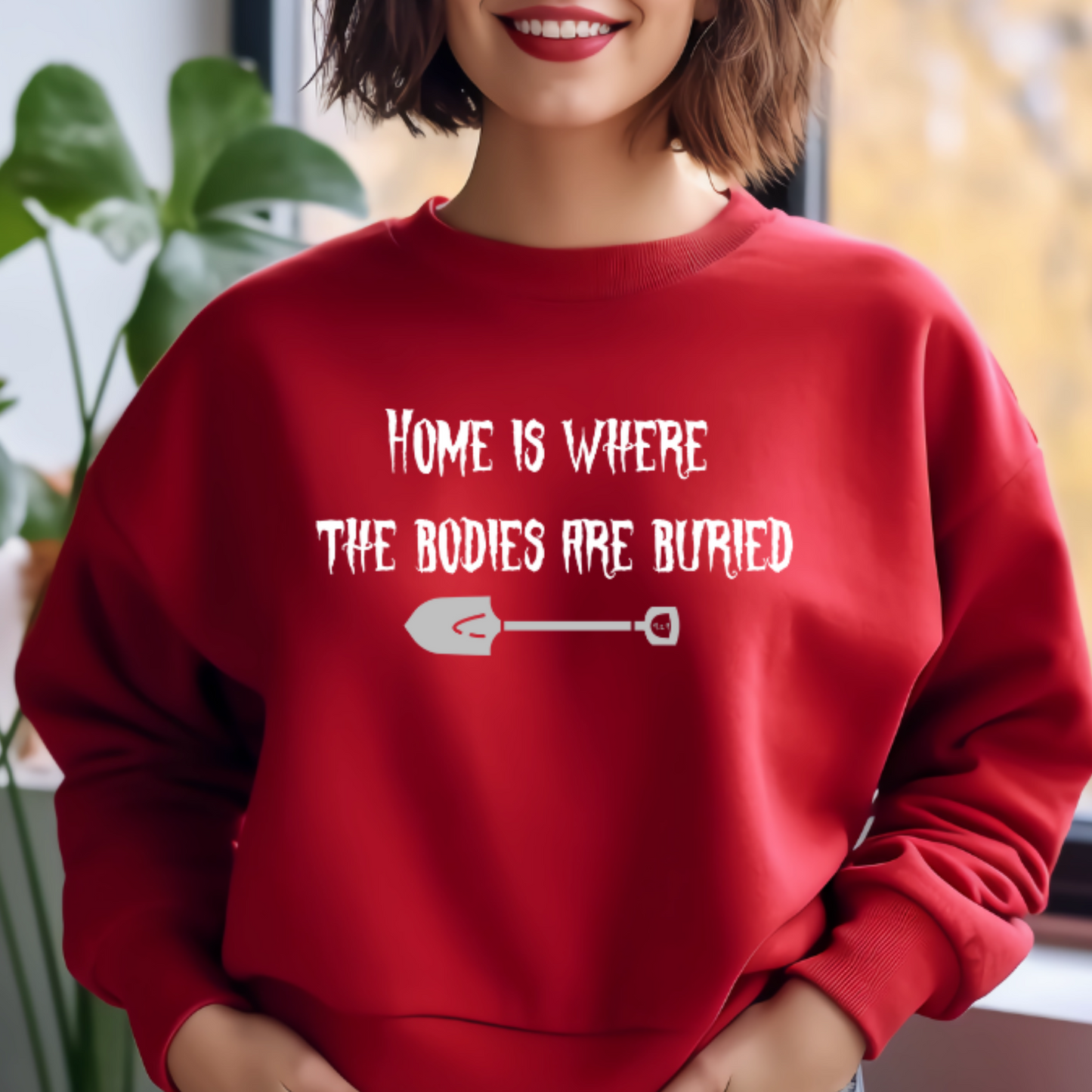 Model with red unisex Gildan sweatshirt with original Nine-29 Design "Home is where" in white