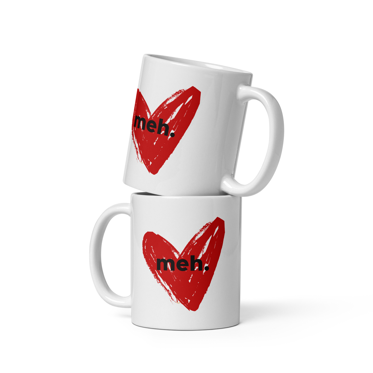 Two stacked-up white mugs with "meh" Original Nine-29 Design