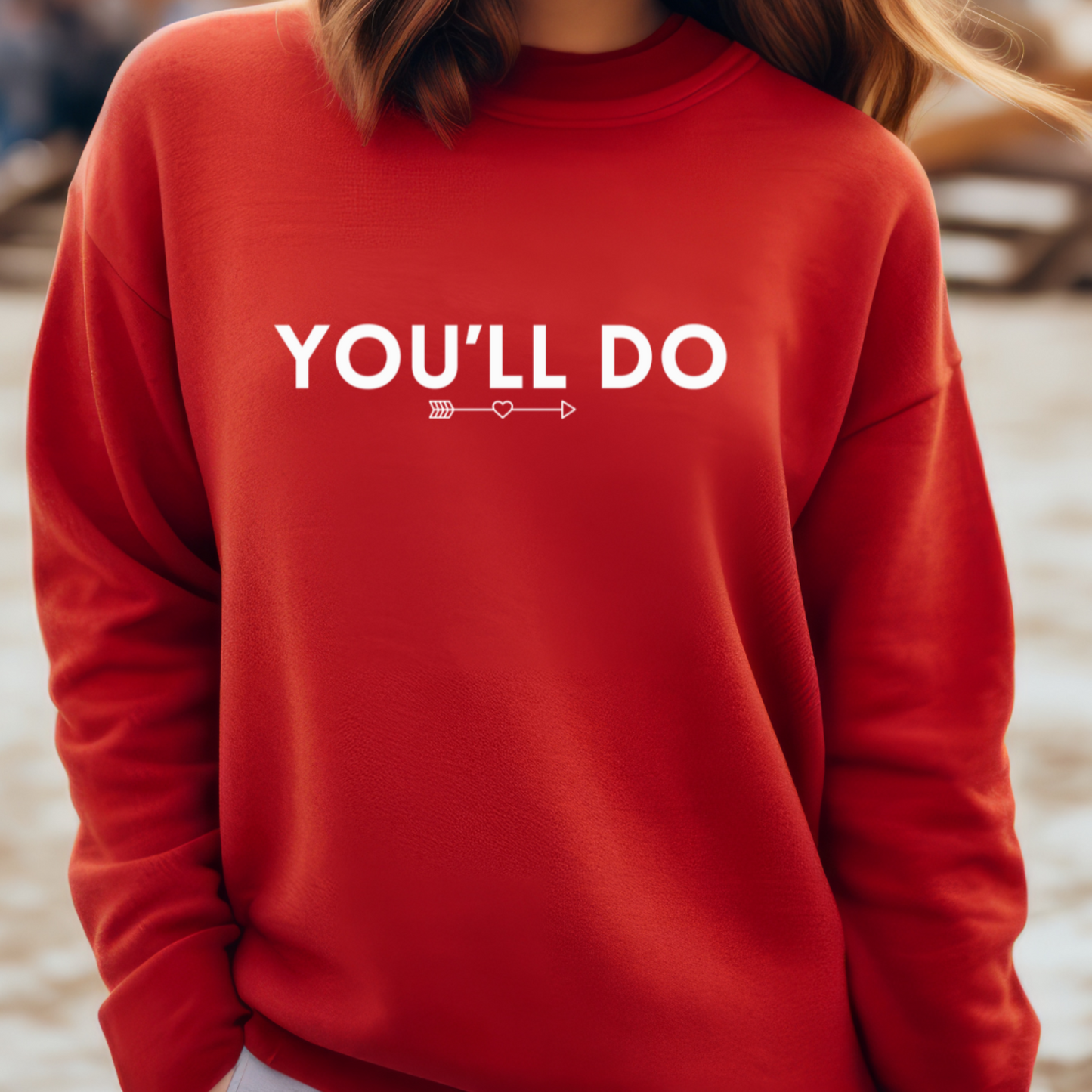 Female model wearing red sweatshirt with "You'll do" Original Nine-29 Design